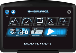 Front view of the Bodycraft T500 treadmill equipped with the 16-inch HD Smart Touch Display showing interactive apps and entertainment options