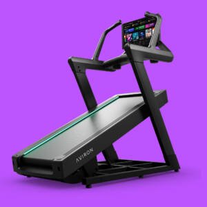 Hero view of the Aviron Summit smart incline treadmill featuring a steep incline deck, HD touchscreen display, and sturdy side handrails