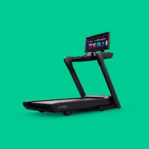 Hero view of the Aviron Podium commercial-grade smart treadmill featuring a large HD touchscreen, robust frame, and high-speed motor